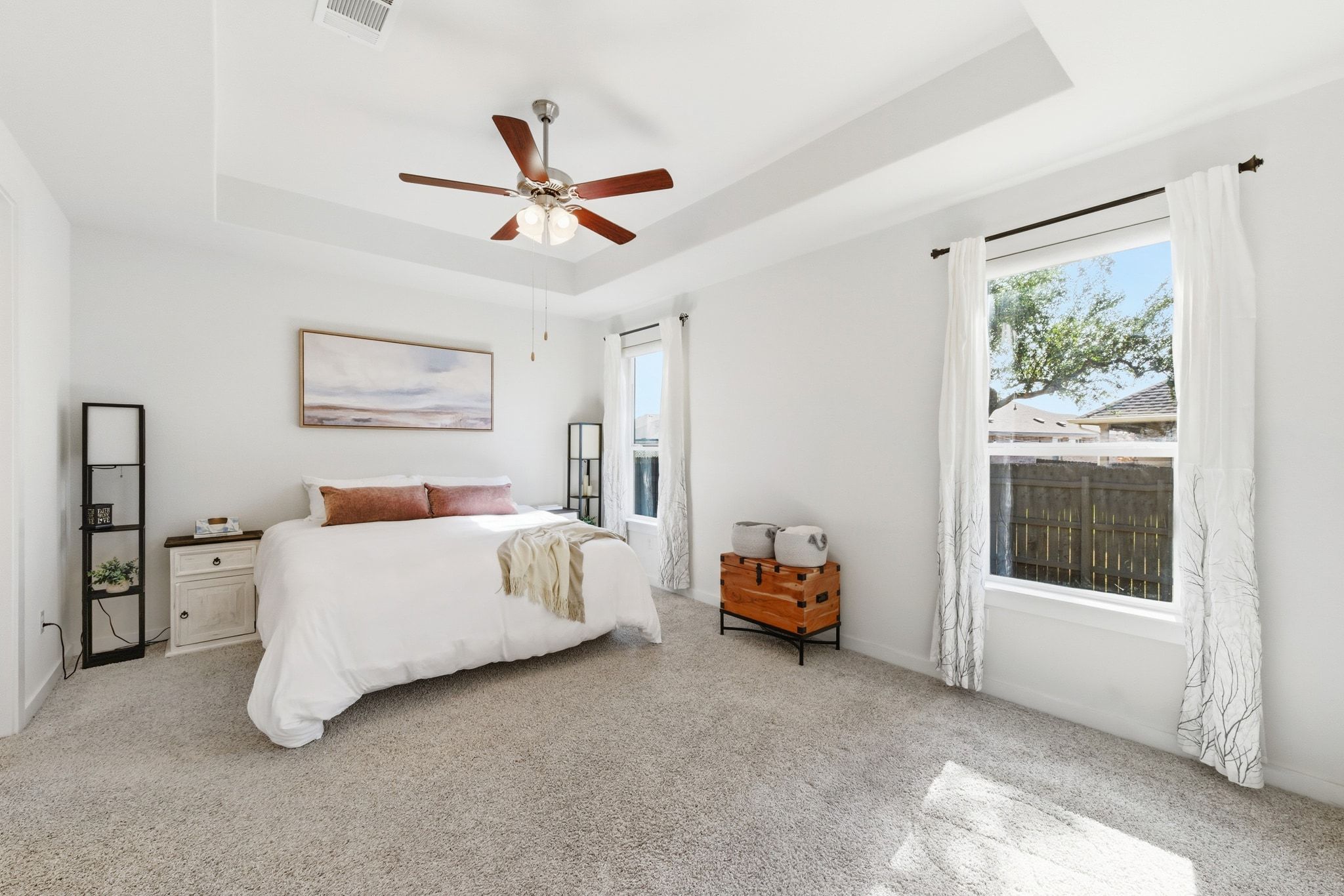 4420 Ingram Road Georgetown, TX 78628 - Photo 17 of 40 Bedroom featuring a raised ceiling, light colored carpet, and a ceiling fan
