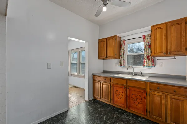 a bathroom with a sink a vanity and mirror