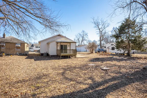 a view of a house with snow on the road
