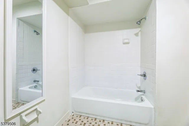 a bathroom with a bathtub and a sink