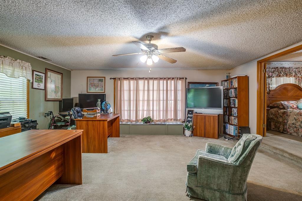 703 East Morgan Street Meridian, TX 76665 - Photo 23 of 38 This is the second living room, but could easily be converted to a 3rd bedroom.