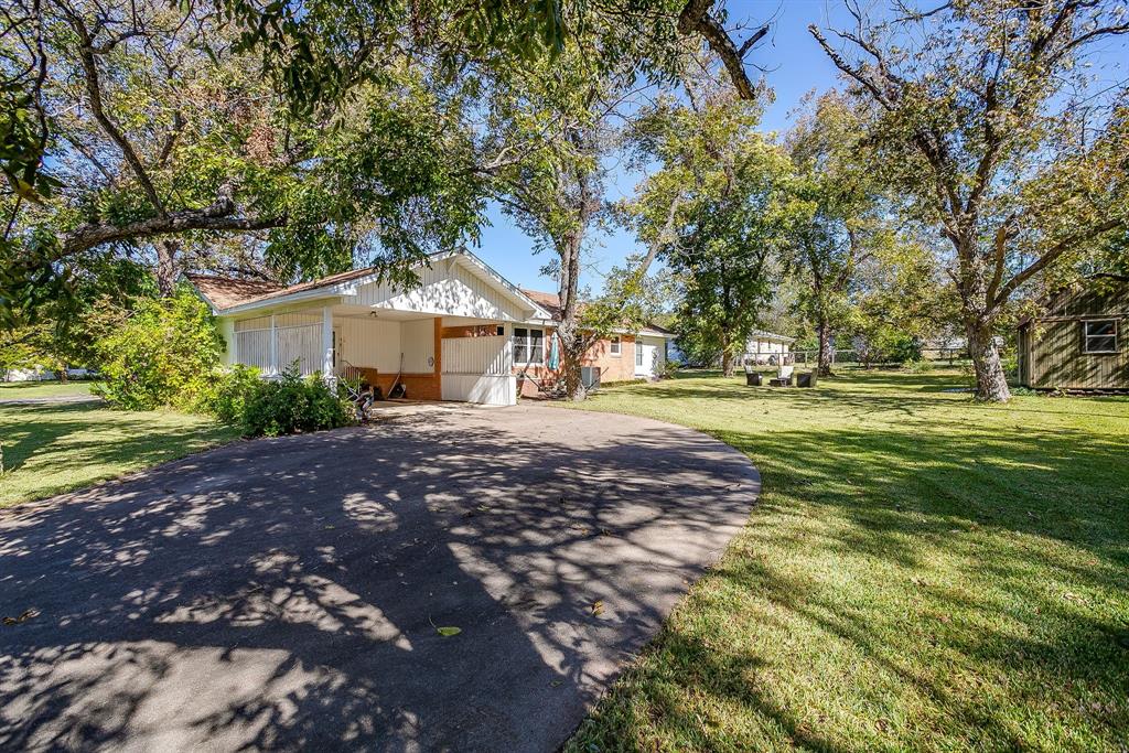 703 East Morgan Street Meridian, TX 76665 - Photo 35 of 38 Large driveway leading to the 2 car carport.