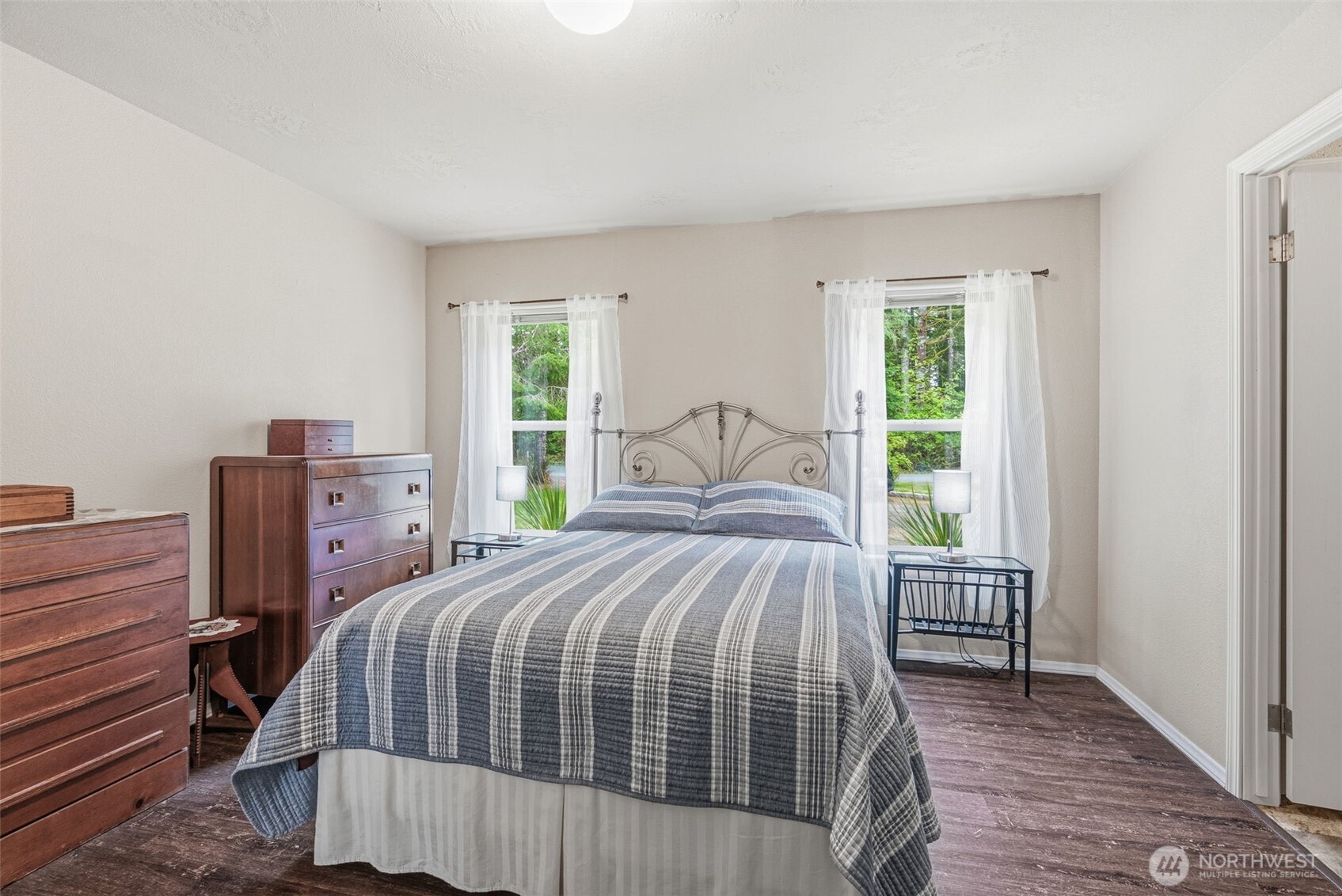 1047 Beaver Creek Road Cathlamet, WA 98612 - Photo 19 of 39 a bedroom with a bed and a window