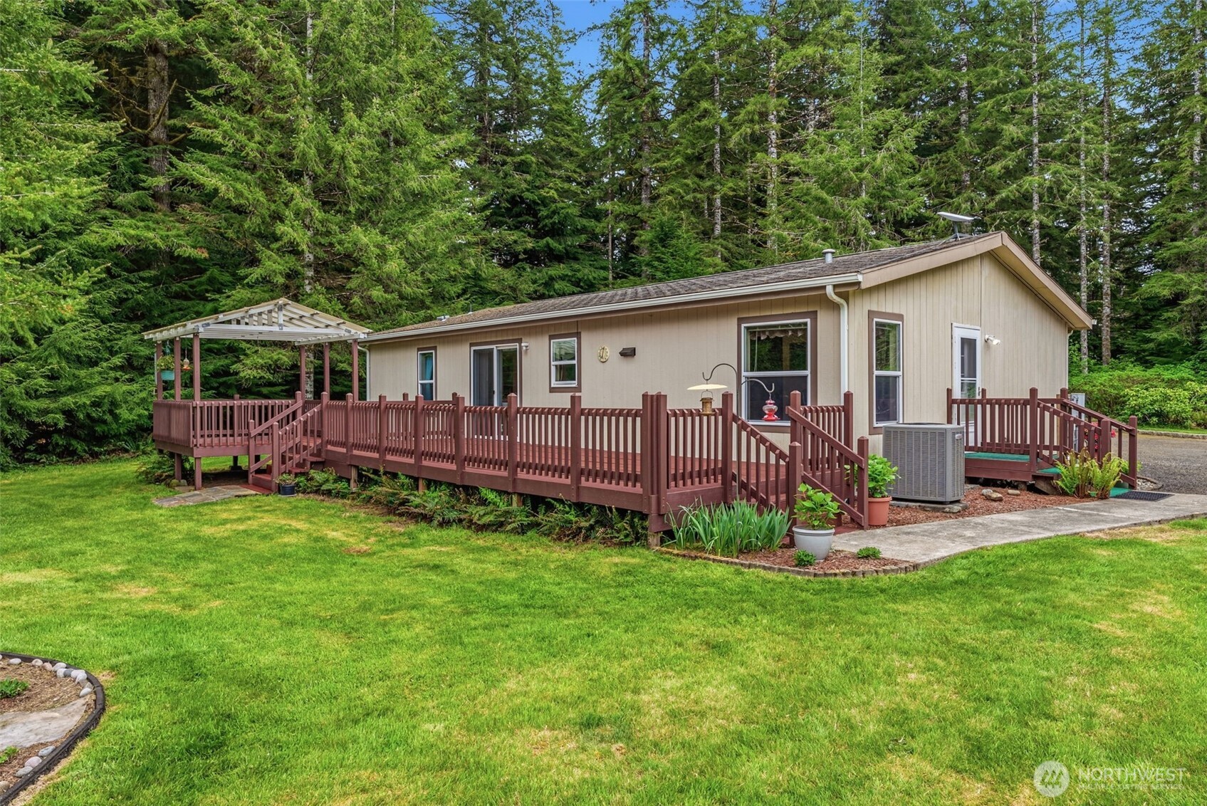 1047 Beaver Creek Road Cathlamet, WA 98612 - Photo 24 of 39 a view of a house with backyard and porch