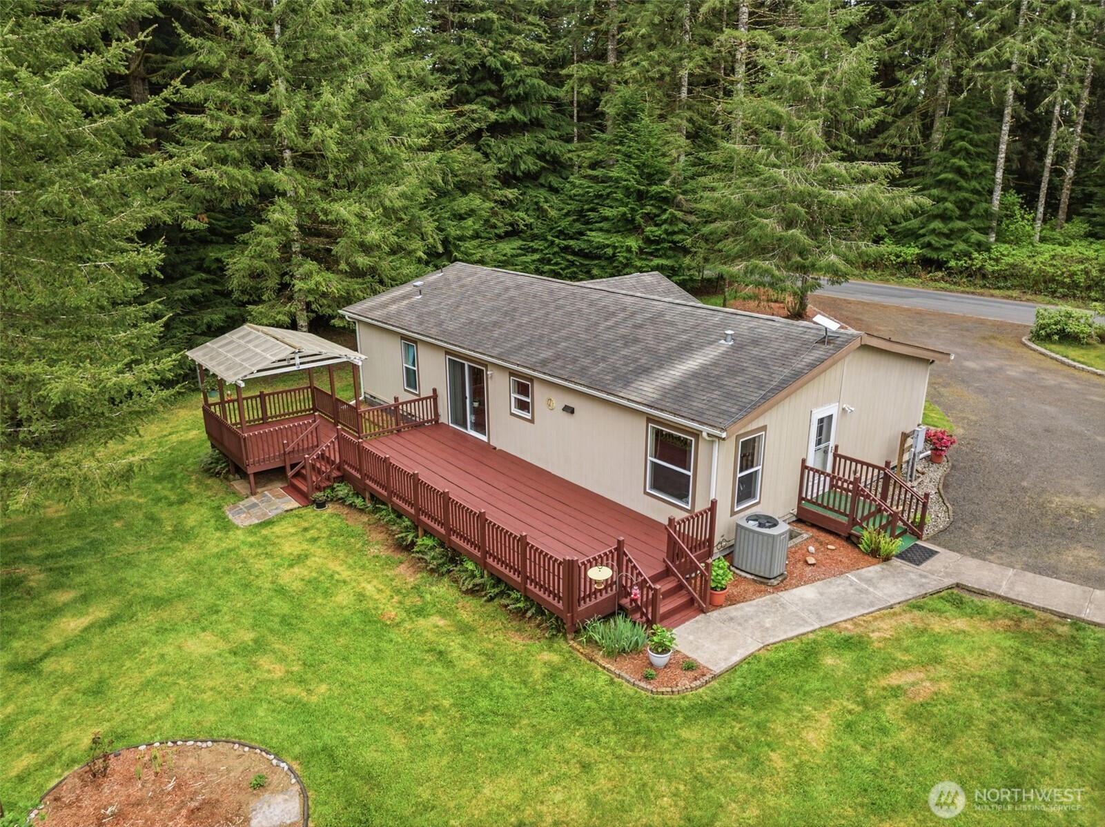 1047 Beaver Creek Road Cathlamet, WA 98612 - Photo 25 of 39 an aerial view of a house with swimming pool and sitting area