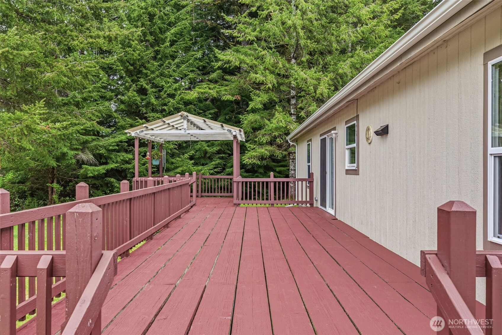 1047 Beaver Creek Road Cathlamet, WA 98612 - Photo 27 of 39 a view of balcony with wooden floor and outdoor seating