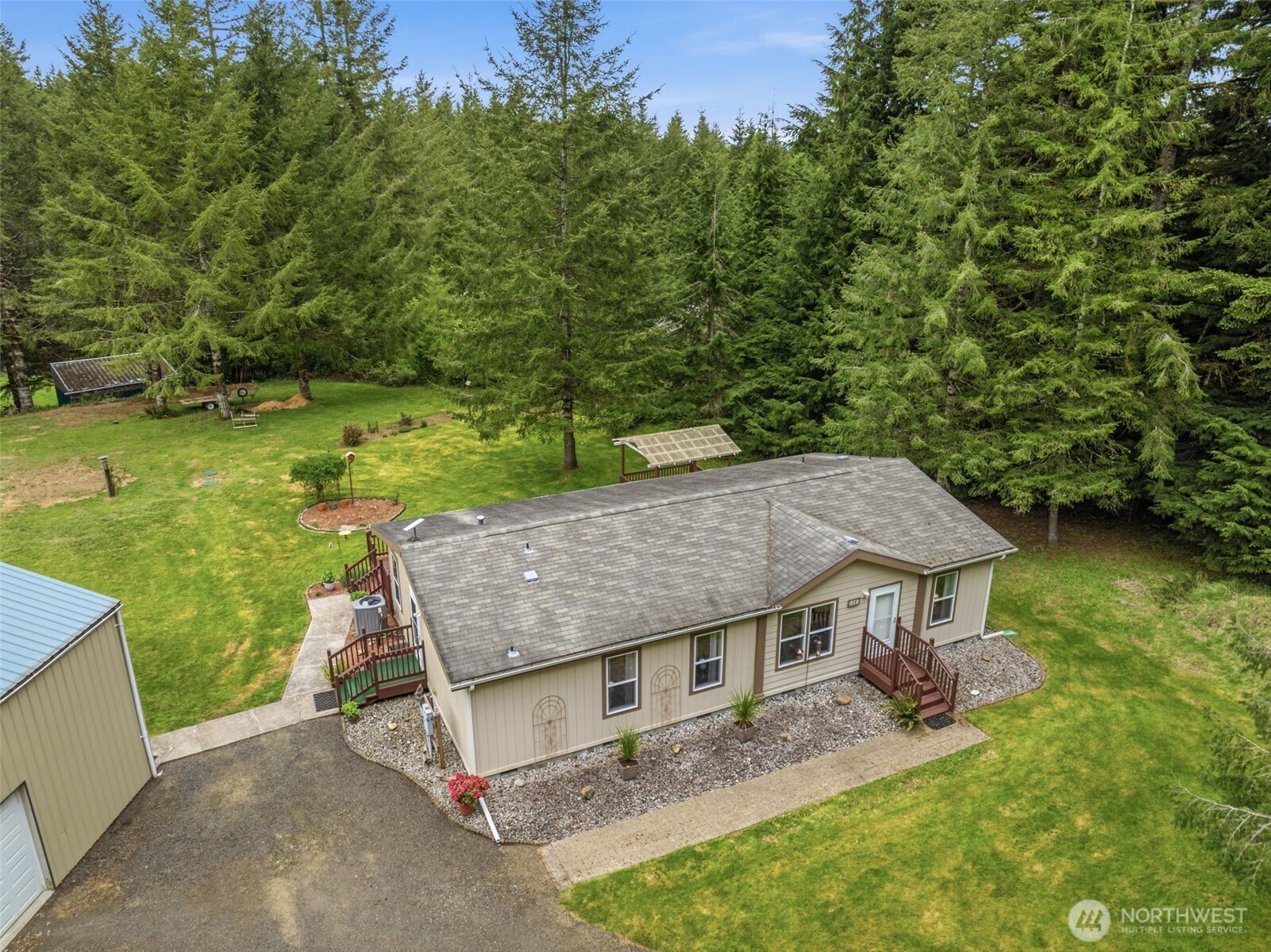 1047 Beaver Creek Road Cathlamet, WA 98612 - Photo 32 of 39 an aerial view of a house with swimming pool garden and patio