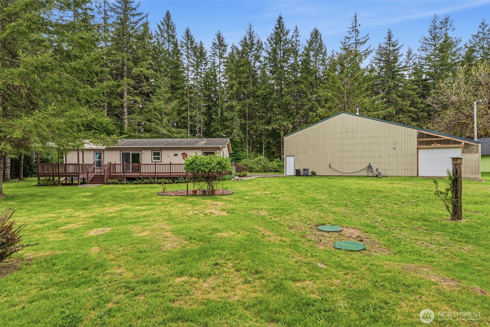 1047 Beaver Creek Road Cathlamet, WA 98612 - Photo 33 of 39 a front view of house with yard and trees in the background