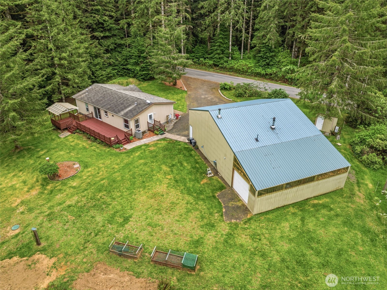 1047 Beaver Creek Road Cathlamet, WA 98612 - Photo 34 of 39 a view of a backyard with a small cabin