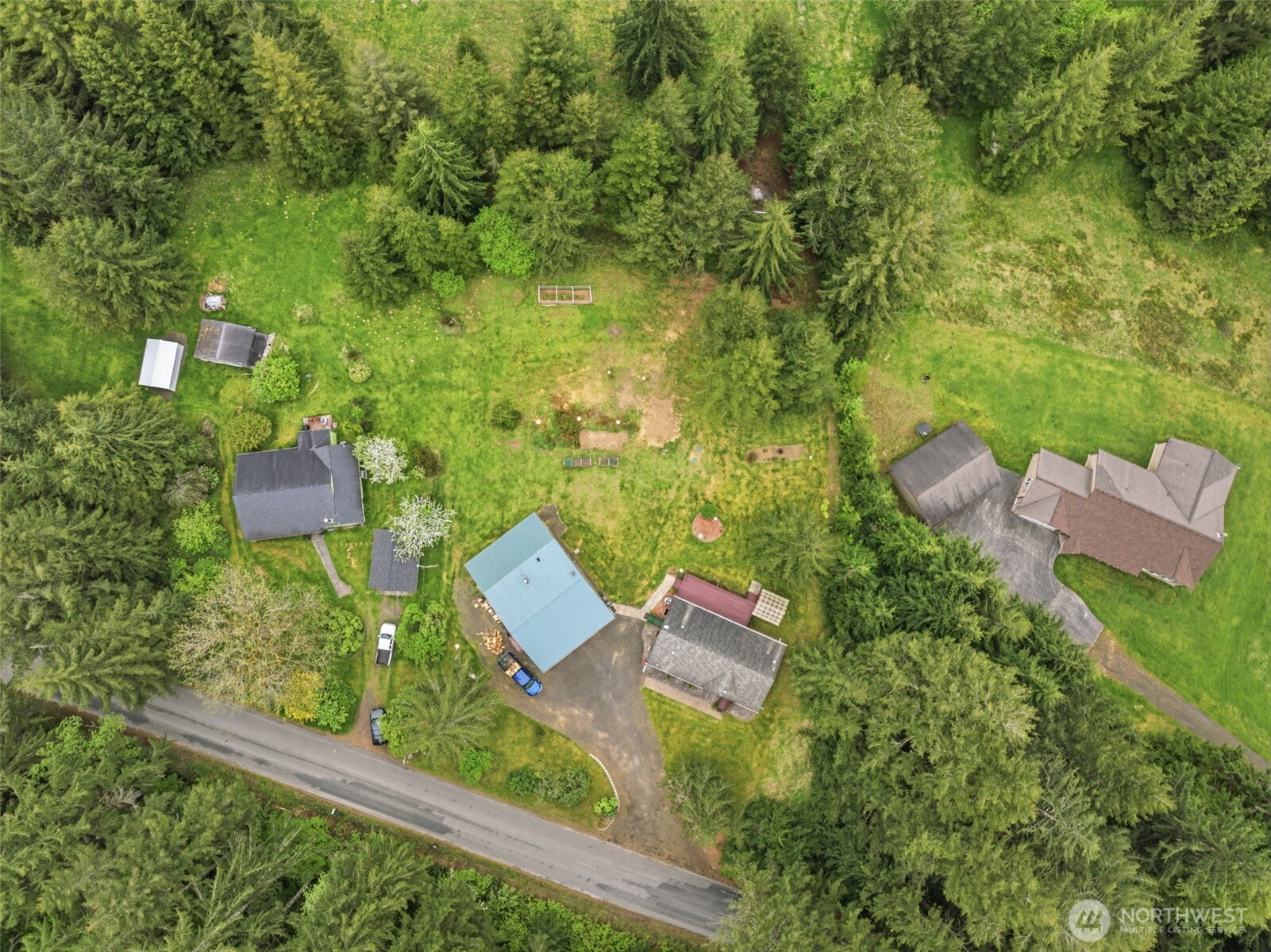 1047 Beaver Creek Road Cathlamet, WA 98612 - Photo 35 of 39 an aerial view of a house with a yard and lake view