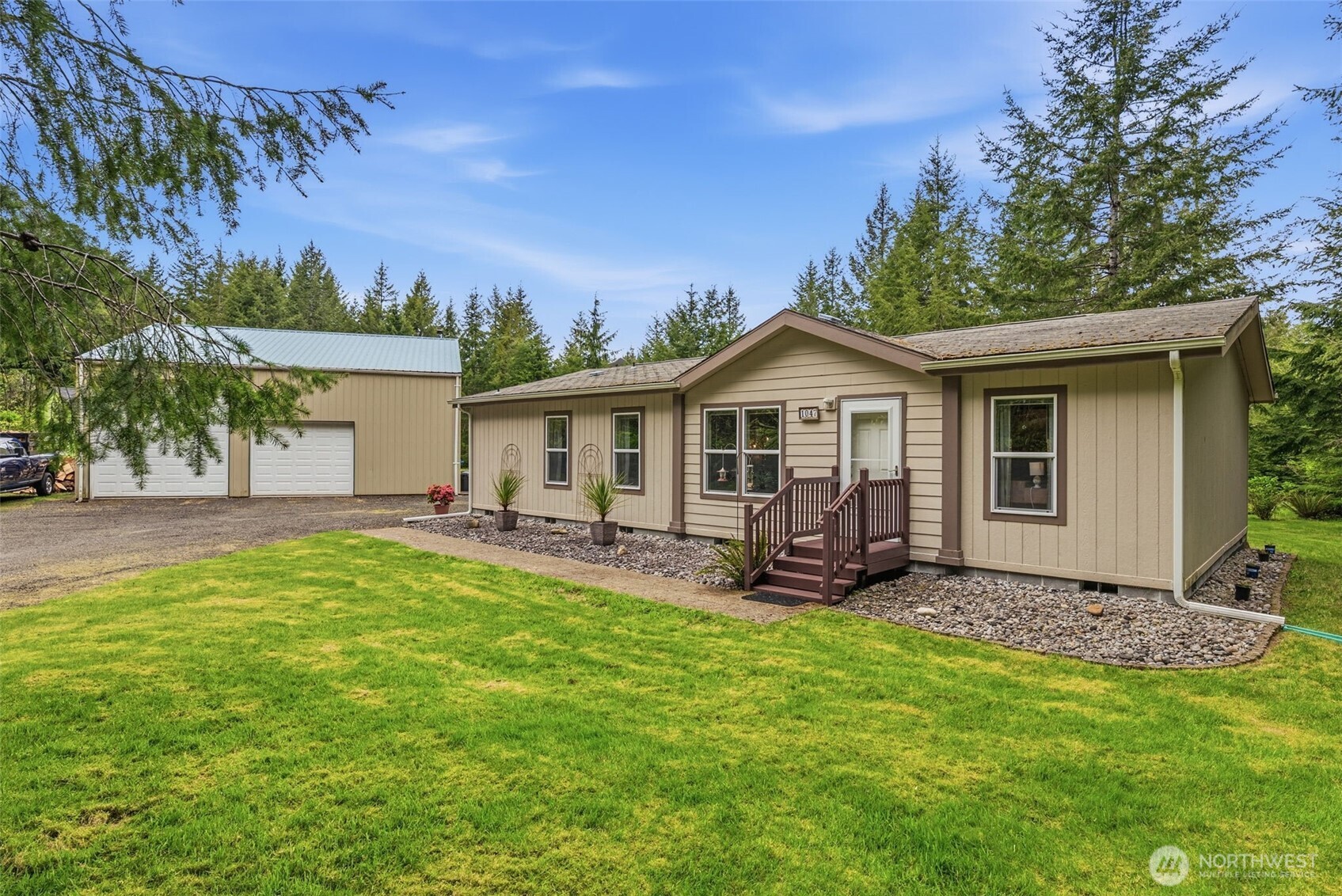 1047 Beaver Creek Road Cathlamet, WA 98612 - Photo 4 of 39 a view of a house with backyard sitting area and garden
