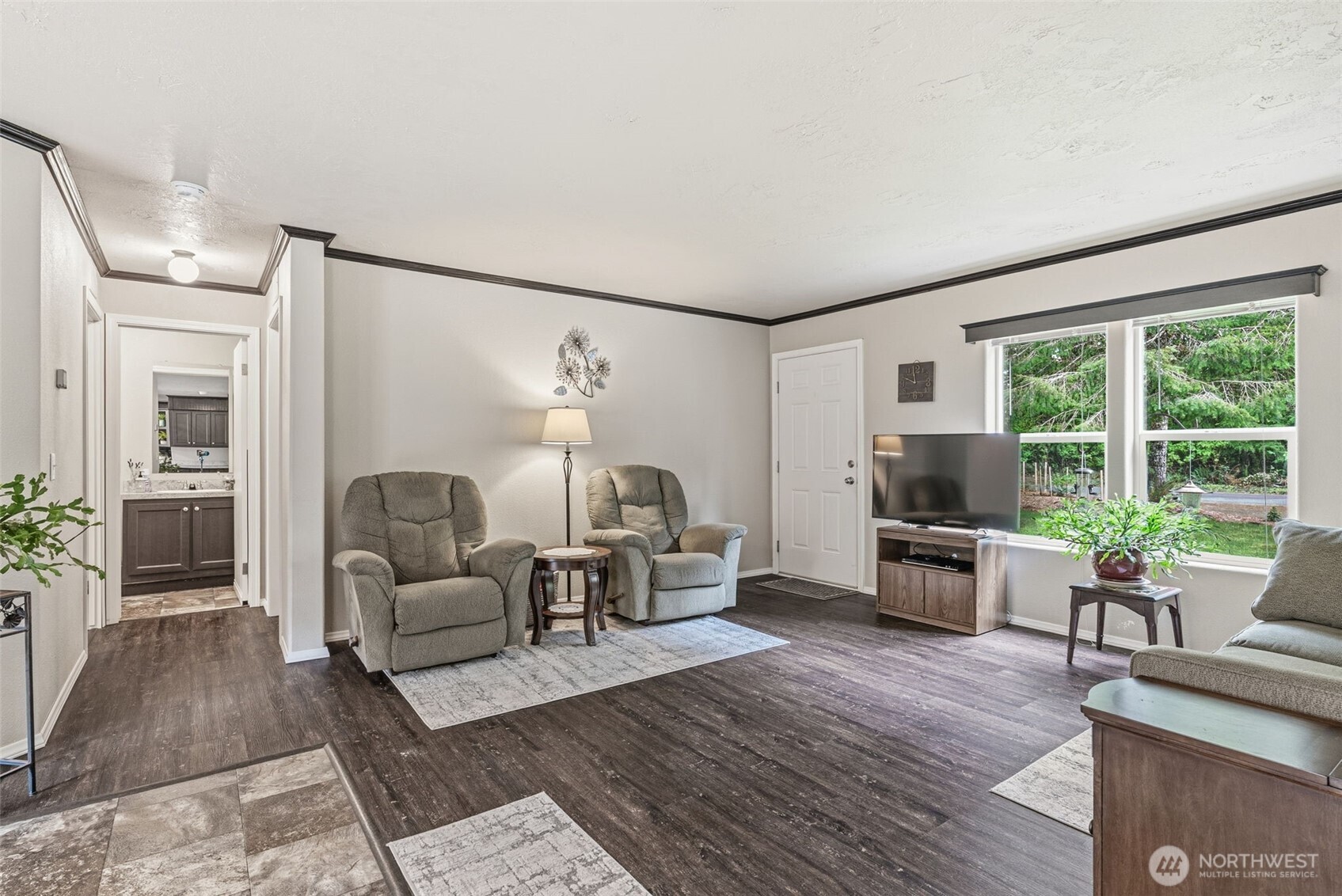 1047 Beaver Creek Road Cathlamet, WA 98612 - Photo 6 of 39 a living room with furniture and a flat screen tv