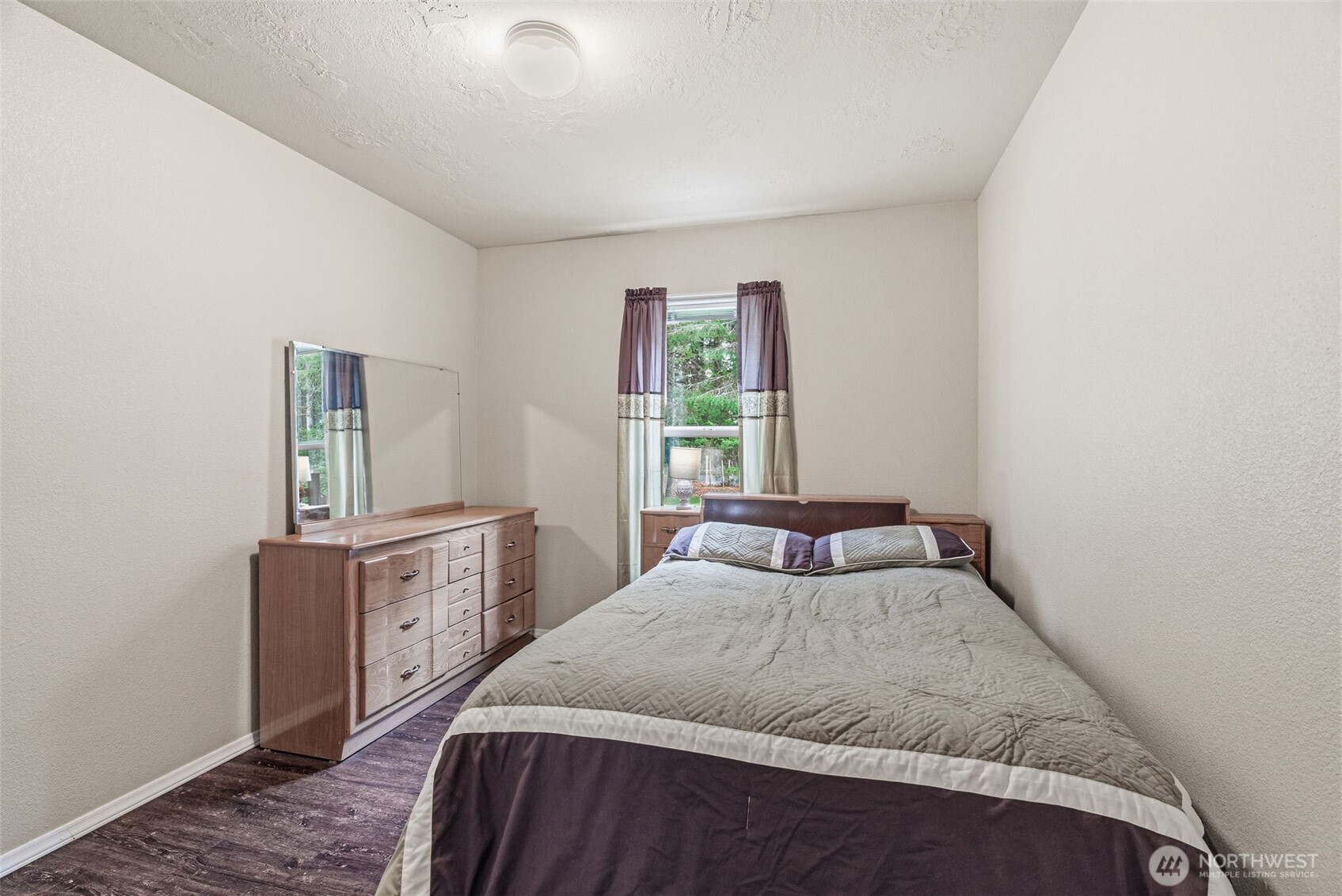1047 Beaver Creek Road Cathlamet, WA 98612 - Photo 8 of 39 a bedroom with a bed and window