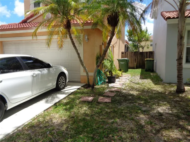 a car parked in front of a house