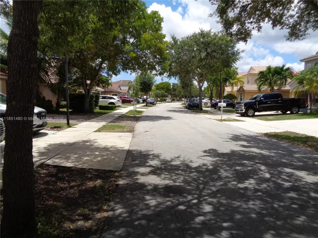 a view of road with trees