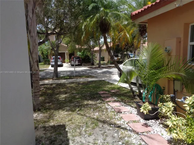 a view of backyard with tree