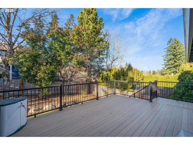 a view of outdoor space with deck and lake view
