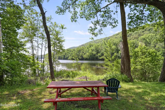 a view of a lake with houses in the back
