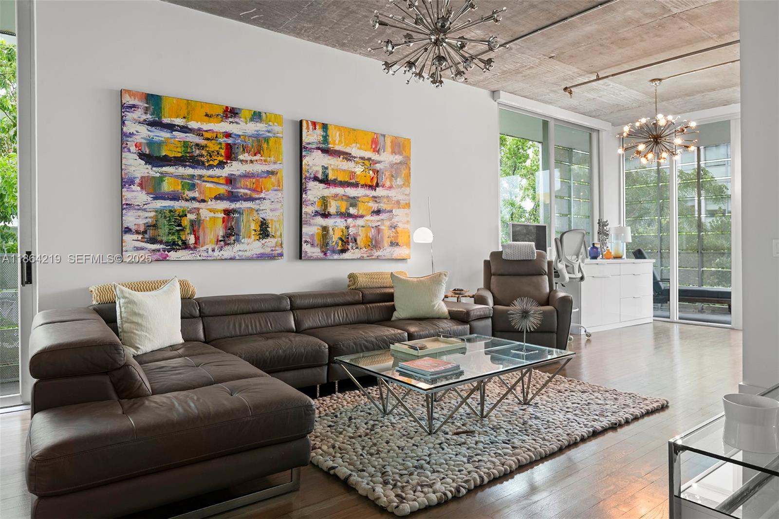 1700 Meridian Avenue, Unit 307 Miami Beach, FL 33139 - Photo 13 of 32 a living room with furniture and a large window