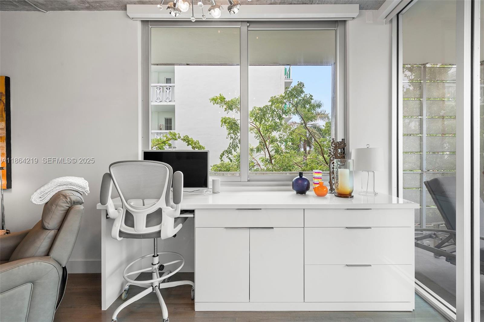 1700 Meridian Avenue, Unit 307 Miami Beach, FL 33139 - Photo 17 of 32 a kitchen with a sink and a cabinets