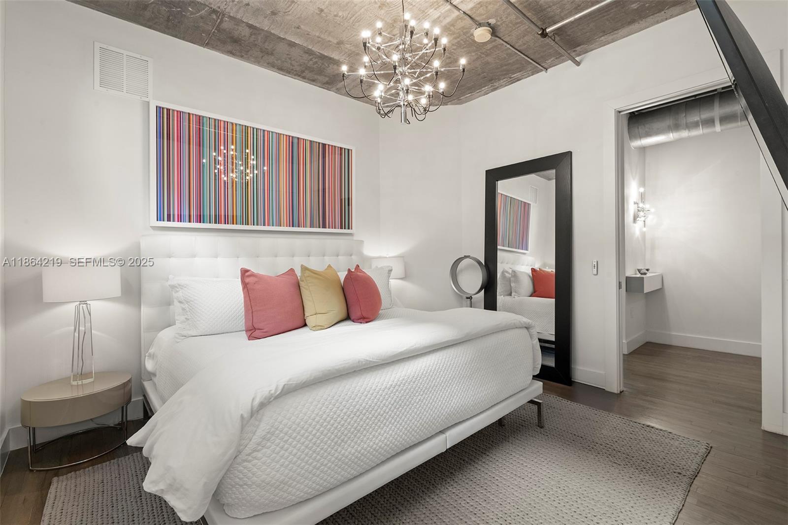 1700 Meridian Avenue, Unit 307 Miami Beach, FL 33139 - Photo 23 of 32 a bedroom with bed and wooden floor