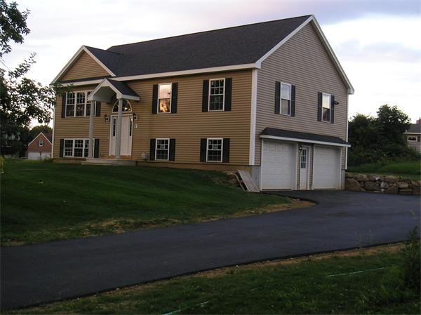 2 Bell Road North Brookfield, MA 01535 - Photo 17 of 27 a front view of a house with a garden
