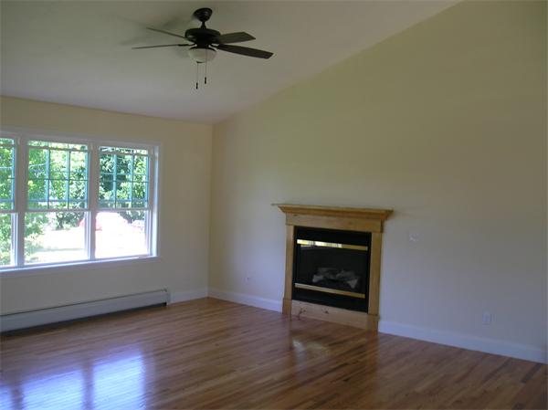 2 Bell Road North Brookfield, MA 01535 - Photo 19 of 27 an empty room with wooden floor cabinet and windows