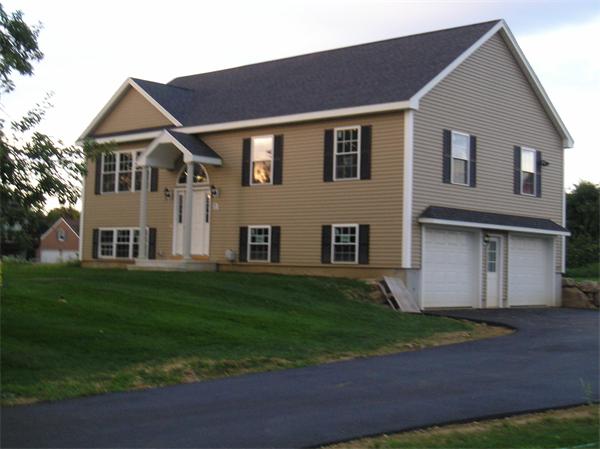 2 Bell Road North Brookfield, MA 01535 - Photo 3 of 27 a front view of a house with a garden and yard