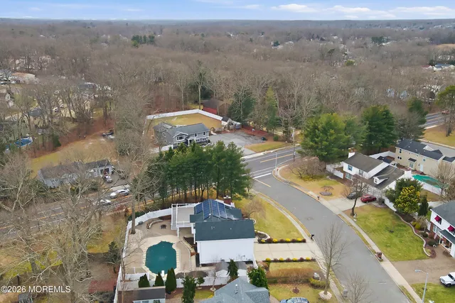 an aerial view of residential house with outdoor space