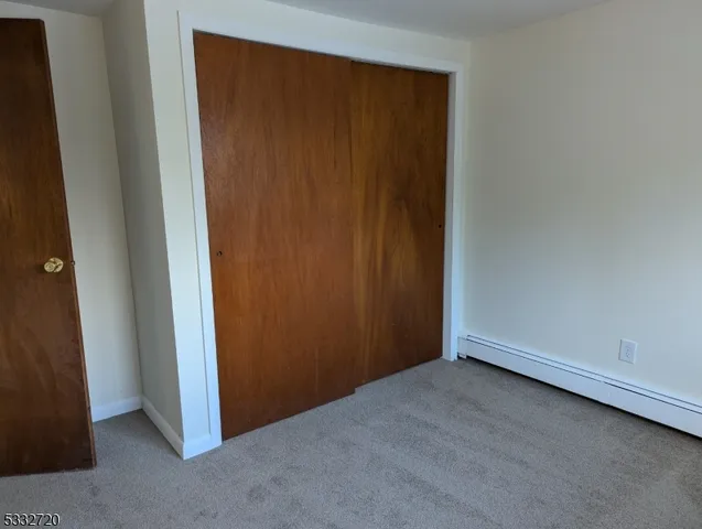 an empty room with closet area