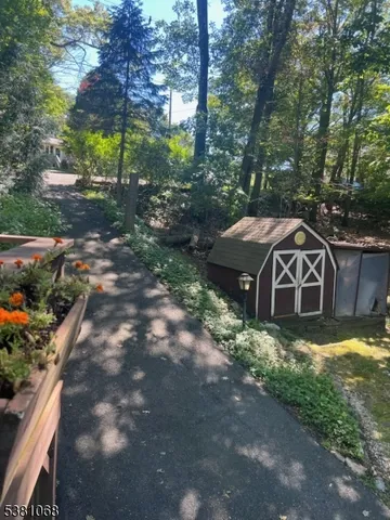 a view of a yard with large trees