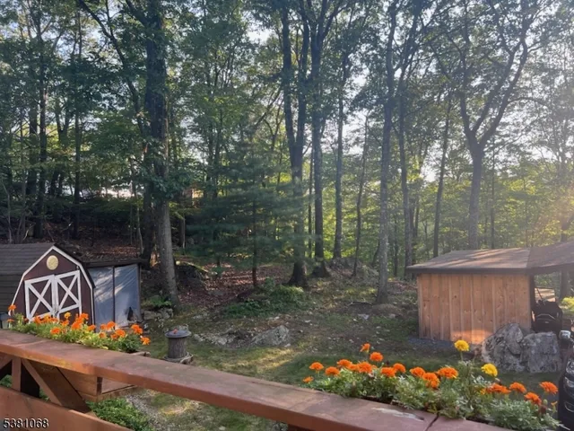 a view of a back yard from a balcony