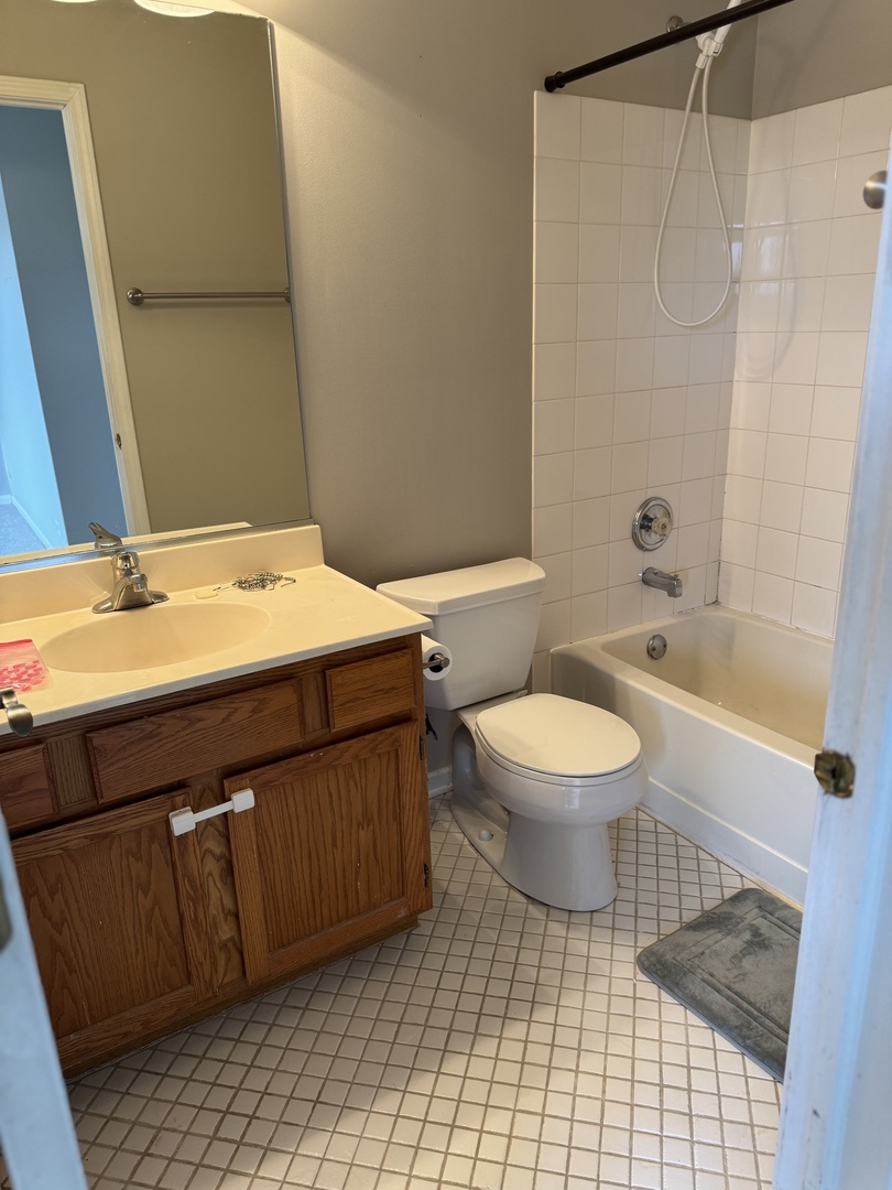 8393 Mystic Darien, IL 60561 - Photo 15 of 21 a bathroom with a sink a toilet and shower