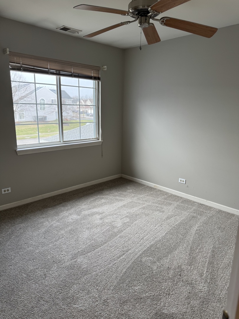 8393 Mystic Darien, IL 60561 - Photo 16 of 21 an empty room with a window
