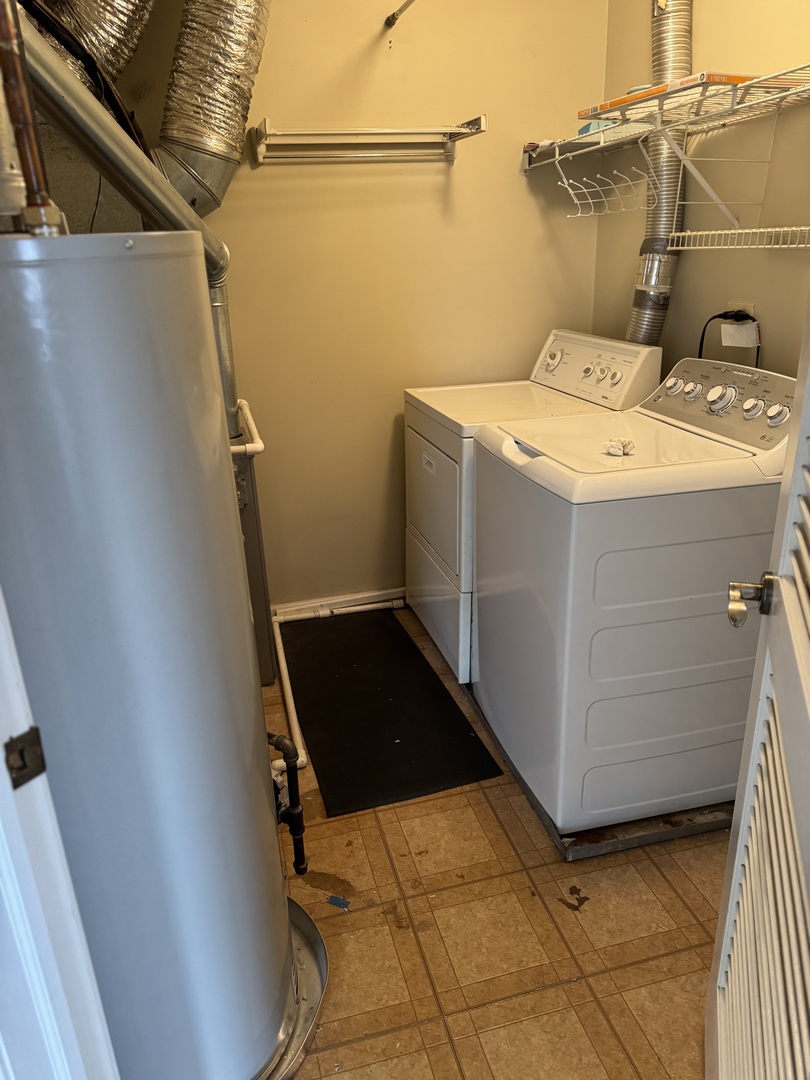 8393 Mystic Darien, IL 60561 - Photo 19 of 21 a utility room with dryer and washer