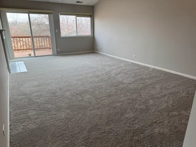 an empty room with a fireplace