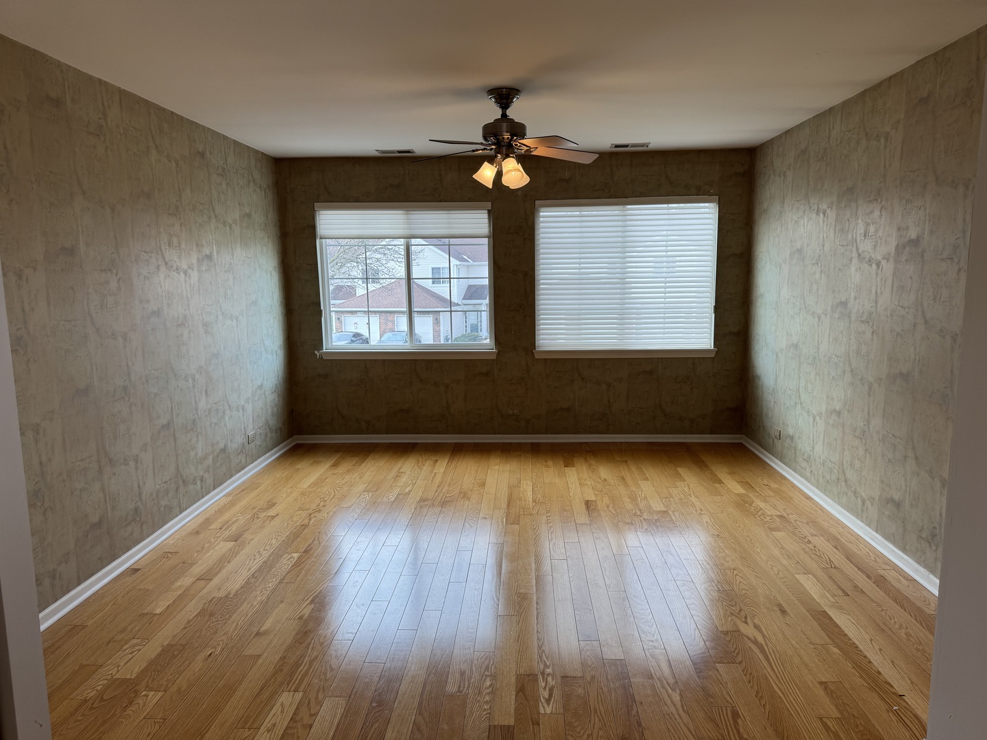 8393 Mystic Darien, IL 60561 - Photo 10 of 21 wooden floor in an empty room with a window
