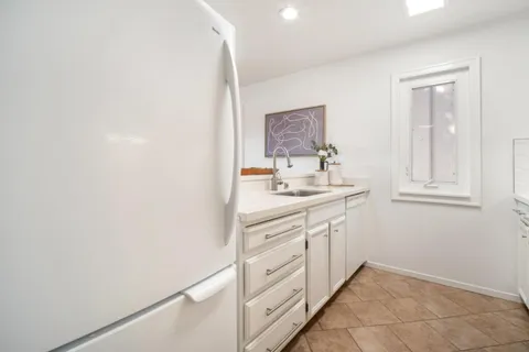 a bathroom with a sink vanity and a mirror