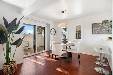 a view of a livingroom with furniture and a potted plant