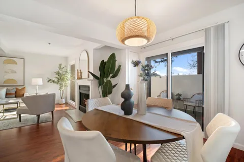 a dining room with furniture a livingroom and chandelier