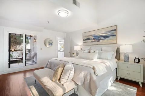 a bedroom with a large bed and a couch