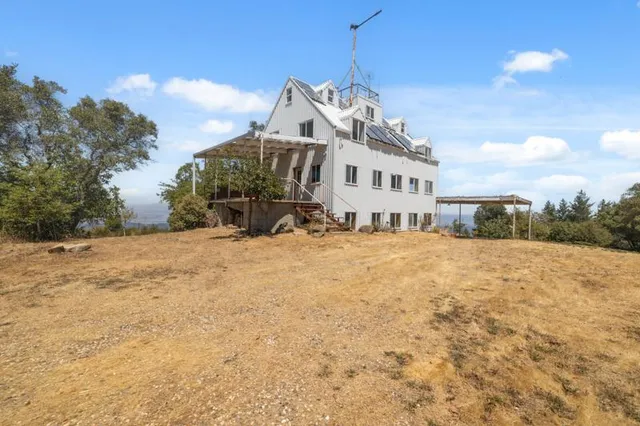 a view of a house with a snow in the yard