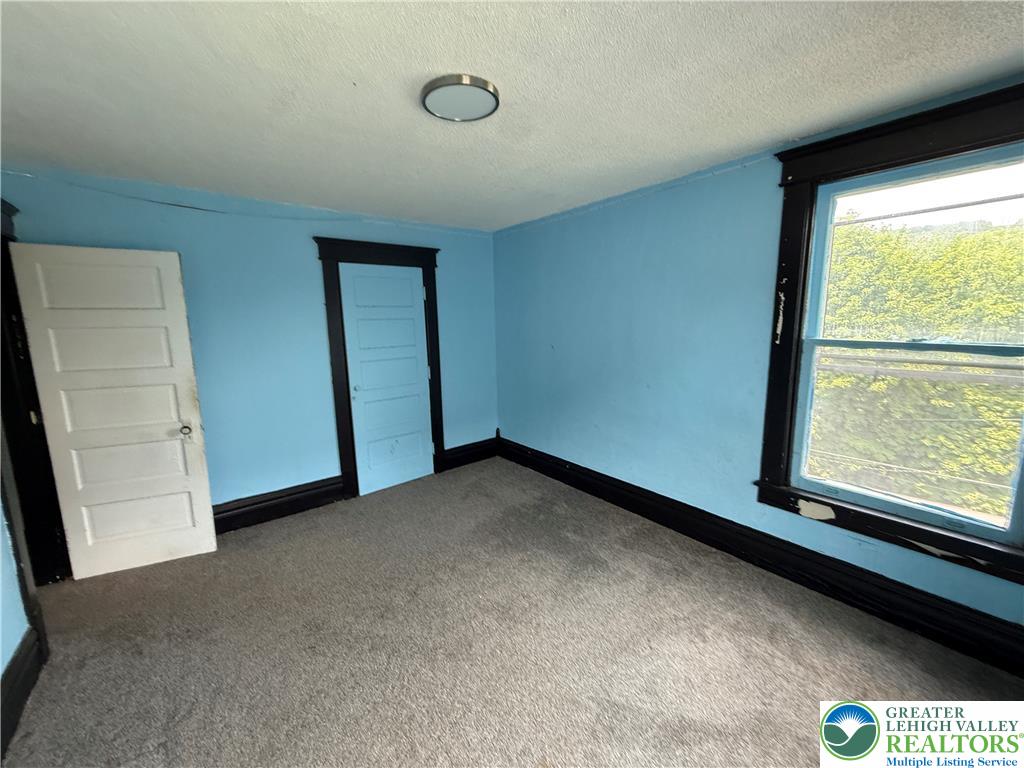 41 West Ridge Street Lansford, PA 18232 - Photo 26 of 40 A well-lit bedroom offering ample space and natural light.