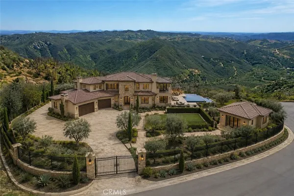 an aerial view of a house with a garden
