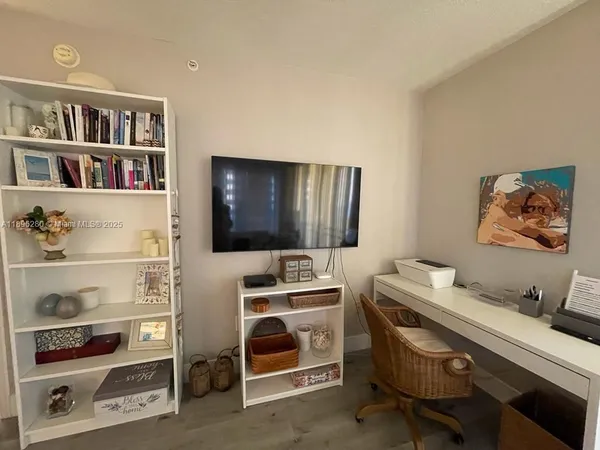 a room that has a bed and a bookshelf in it