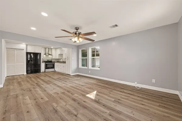 a view of an empty room with a window