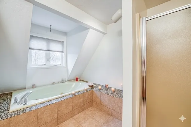 a bathroom with a tub and a shower