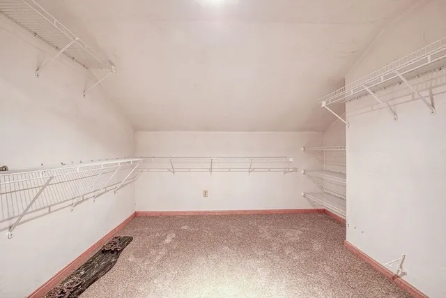 a view of storage and utility room with empty racks