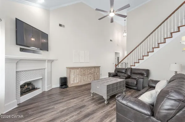 a living room with couches and a fireplace