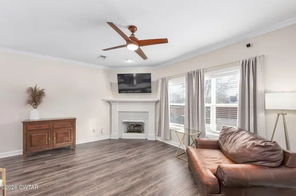 a living room with furniture and a fireplace